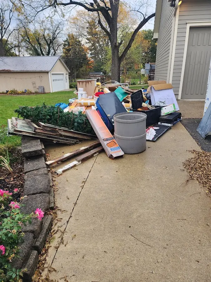 Dumpster being loaded with debris for 30 Yard Dumpster Rental in South Park